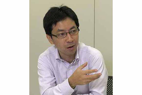 写真：RFID企画・統括・ 推進機能プロジェクト PJリーダー 佐藤 雅一 様