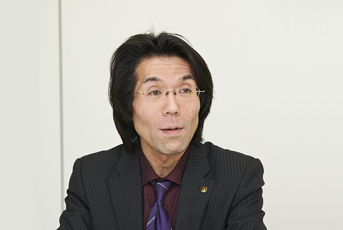 写真:情報システム部 企画管理グループ マネージャー 藤生好則 様